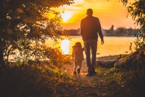 dad and child walking together