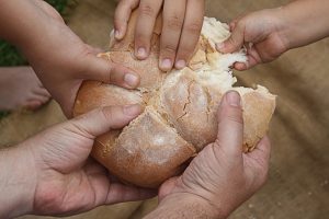 hands holding bread
